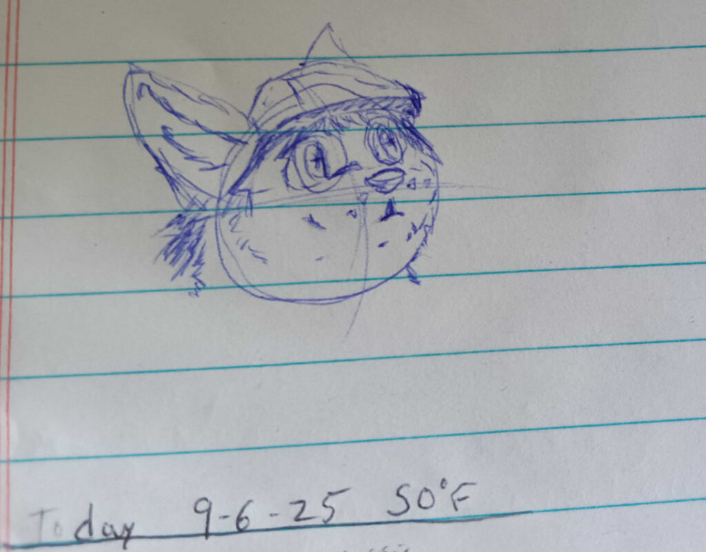 Valla looking hopeful up and to the right. Standard Vallawalf attire squashy hat and glasses.